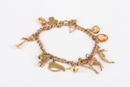 A small 9ct gold charm bracelet, set with 10 charms, 26.4 grams