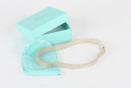 A Tiffany Sterling Silver necklace, of plain linked form, in original gift box, pouch and with
