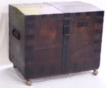 A large 19th century oak and iron bound silver chest, with slightly domed lid and cast iron ring