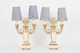 A pair of ornamental table lamps, each with squared central alabaster pillar topped with gilt