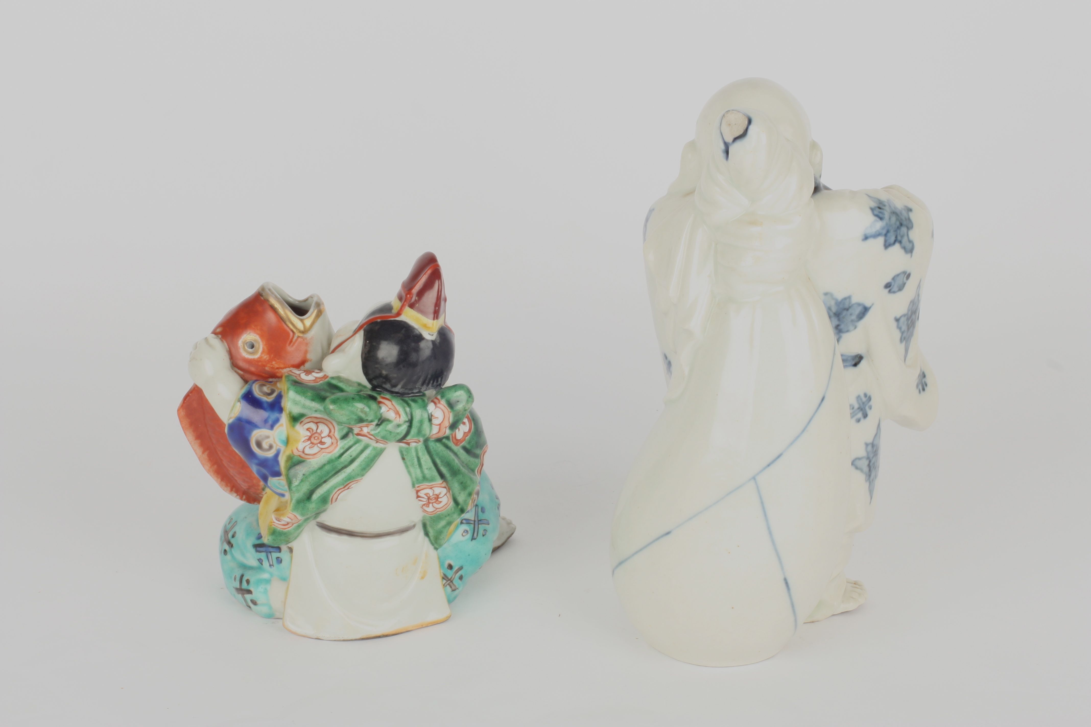 Two 20th century Chinese porcelain figures, one blue and white figure of Buddha in standing pose, - Image 2 of 2