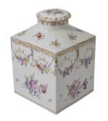 An early 20th century Dresden porcelain square shaped tea caddy, hand painted with floral decoration