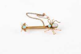 A 9ct gold and opal set spider and fly bar brooch, with spider and fly set with opal bodies, with