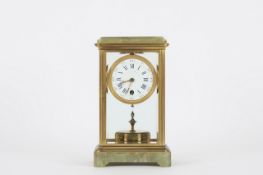 A French gilt brass and onyx four hundred day mantel clock, early 20th century, probably by Claude