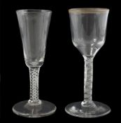 Two 18th century opaque twist stem drinking glasses, one with tall tapered bowl, the other with
