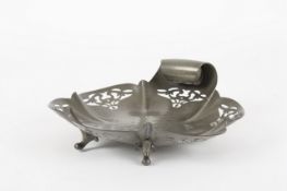 An Arts and Craft pewter fruit stand, of fluted flower form with hammered design to the centre and