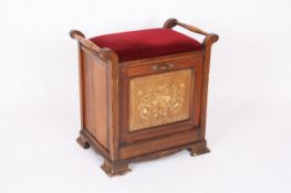 A Victorian inlaid mahogany piano stool, with upholstered hinged seat above a music compartment,