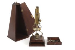 A brass Culpeper-type microscope by Dollond, circa 1820, signed on the circular stage Dollond