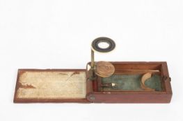 A folding Withering-type microscope, circa 1795, the brass arm, and ivory mounted lens and stage