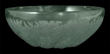 An R. Lalique bowl `Chicoree`, the frosted bowl with moulded spiralling fern pattern to the