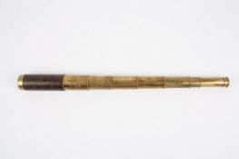 A brass and leather eight draw refracting telescope, circa 1850, unsigned, unextended 16cm, extended