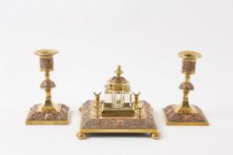 A Victorian copper and brass desk set, comprising an inkwell on a square brass base with pen