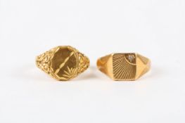Two gentleman`s 18ct gold signet rings, one with repoussé decoration the other set with small