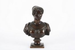 A 19th century bronze bust of a young girl by Durand, French, dated 1822, with dedication to the