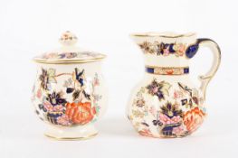 A Masons ironstone cream jug and matching pot with cover, with Irami style decoration on cream