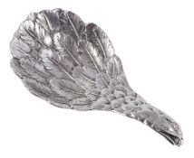 A silver `eagles wing` caddy spoon, hallmarked London 1971, the bowl of oval shape engraved with