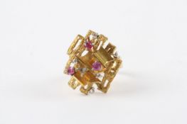 A 1960s 18ct gold abstract ring, set with three rubies and five diamonds (one stone missing). 8g