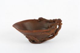 Description: A 17/18th century Chinese rhinoceros horn libation cup the rich, dark tapered cup