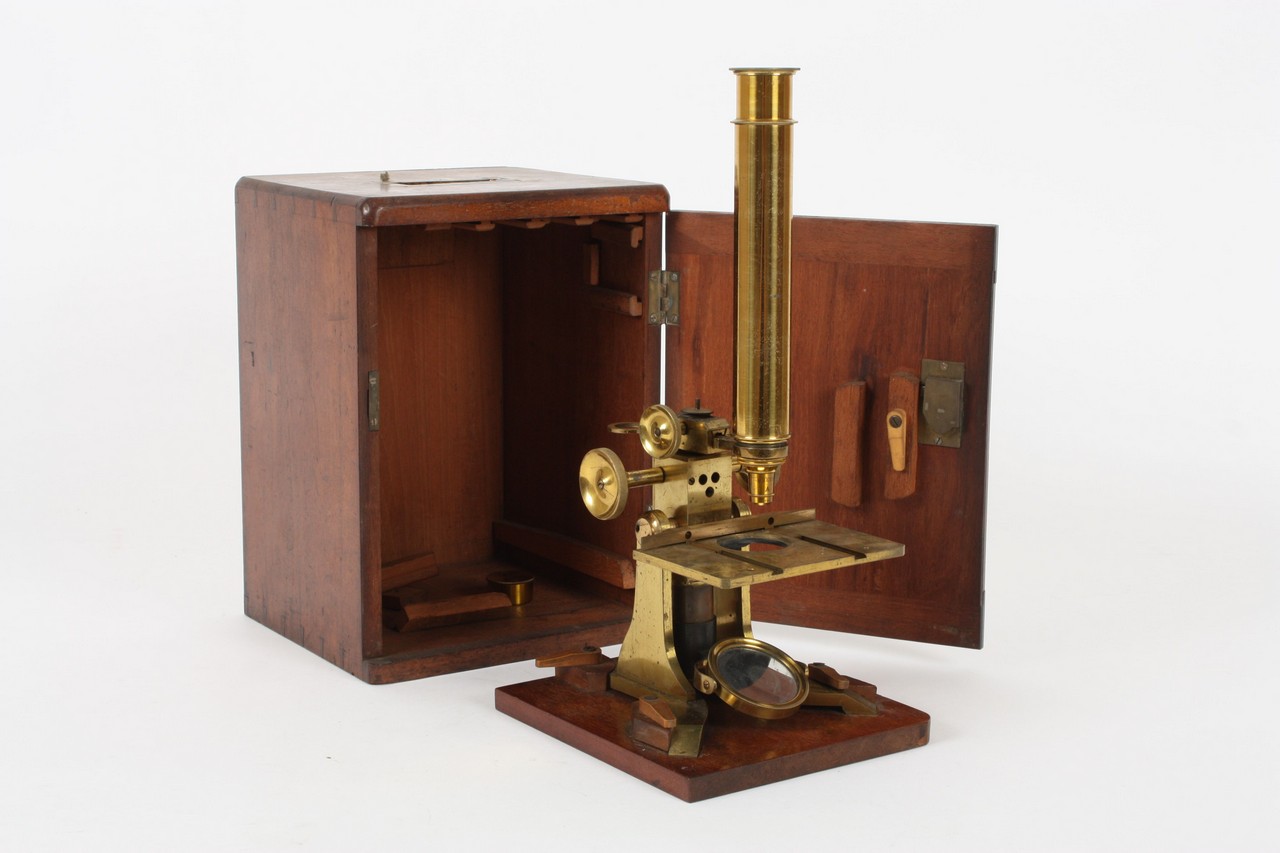A brass Negretti and Zambra monocular microscope late 19th century, signed on the Y shaped base,