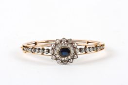 A fine 19th century 15ct gold bangle set with diamonds and sapphire, with approximately 44