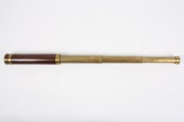 A brass and rosewood three draw refracting telescope by Cutts, Sutton & Son, circa 1850, signed on