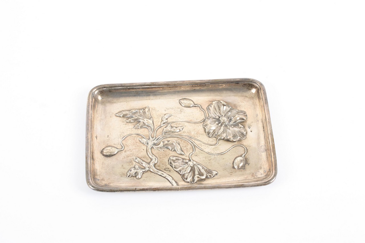 An Art Nouveau Continental silver pin tray, early 20th century, with repoussé decoration of