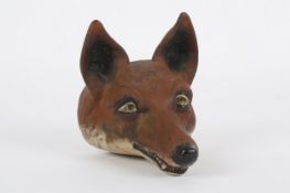 A painted cast iron figure of a fox`s head, late 19th, early 20th century, with hole drilled to