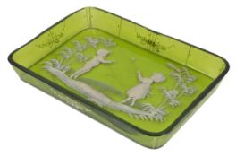 A 19th century Mary Gregory green glass dressing table tray, with white enamel decoration of two