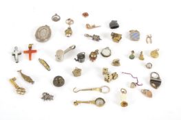 Another collection of miniature charms, late 19th and early 20th century, including charms in the