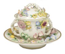 A Modern Italian china pot, cover and matching saucer, elaborately decorated with flowers in high