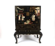 A Japanese black lacquer cabinet, early 20th century, the lacquered cabinet with Japanned