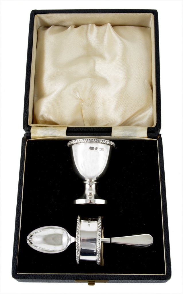 A cased silver Christening set, with egg cup, napkin ring and spoon, contained within a velvet lined