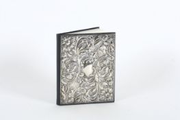 A silver covered leather address book in Art Nouveau style, in original gift box. 14.5 x 11.5cm In