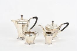 An early 20th century four piece silver tea set, hallmarked Sheffield 1912, comprising tea pot and