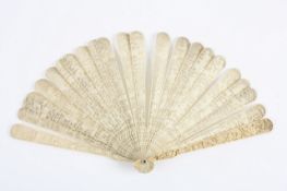 A 19th century Chinese carved ivory fan, carved front and back on the outer guard sticks with