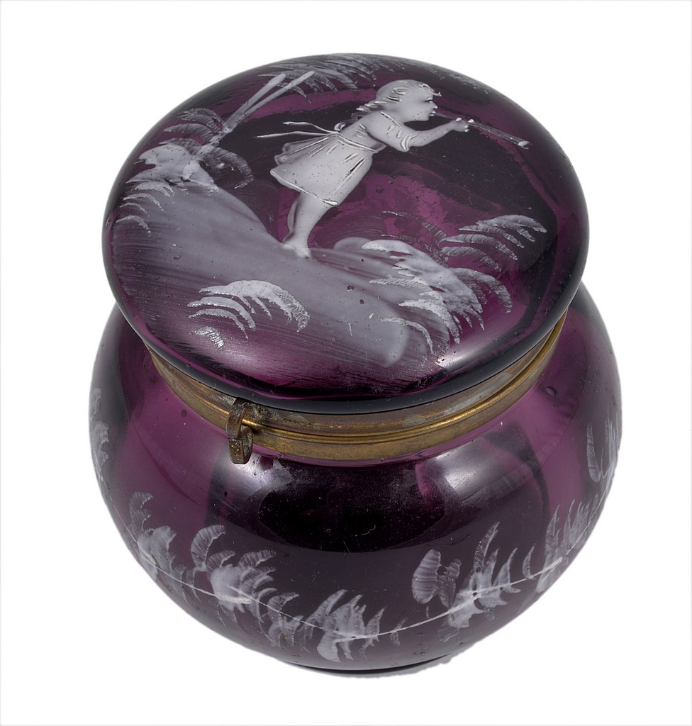 A 19th century Mary Gregory purple glass powder jar and cover, with white enamel decoration of a