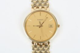 A 14ct gold Tissot gentleman`s watch, with calendar, seconds hand and baton numerals on 14ct gold