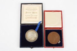 A Queen Victoria 1837-1897 Diamond Jubilee bronze medal in a case, together with a white medal