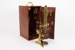 A lacquered brass compound monocular microscope by Ross & Broadhurst Clarkson, circa 1855, stamped