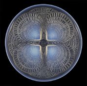 A René Lalique plate `Coquilles`, the iridescent plate with four moulded stylised shells to the