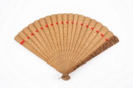 A mid 19th century Chinese carved wooden fan, depicting temples, figures and foliage. 26.8cm long