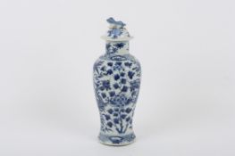 A 19th century Chinese blue and white vase and cover, the body decorated with dragons against