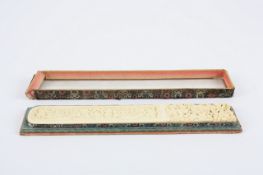 A Cantonese finely carved ivory page turner in original case, early 20th century finely carved