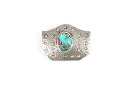 A Murrle Bennett & Co. silver and turquoise brooch, the hammered brooch in Arts and Crafts design