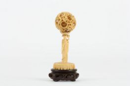 A Chinese carved ivory concentric ball on stand, circa 1900, consisting of 6 internal layers, carved