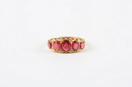 A Victorian 18ct gold and ruby ring, set with five rubies in claw setting In good overall condition