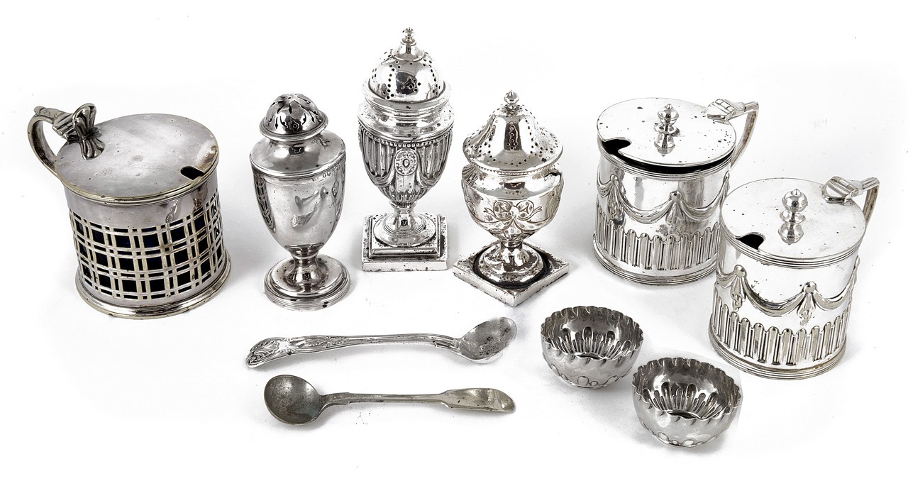 A selection of silver and silver plated assorted condiments, comprising two silver peppers and one
