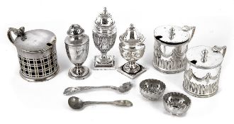 A selection of silver and silver plated assorted condiments, comprising two silver peppers and one