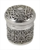 A Victorian silver dressing table jar, hallmarked London, 1895, with heavy repoussé decoration to