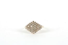 A 9ct gold oval diamond cluster ring, Modern, set with numerous small diamonds In good overall